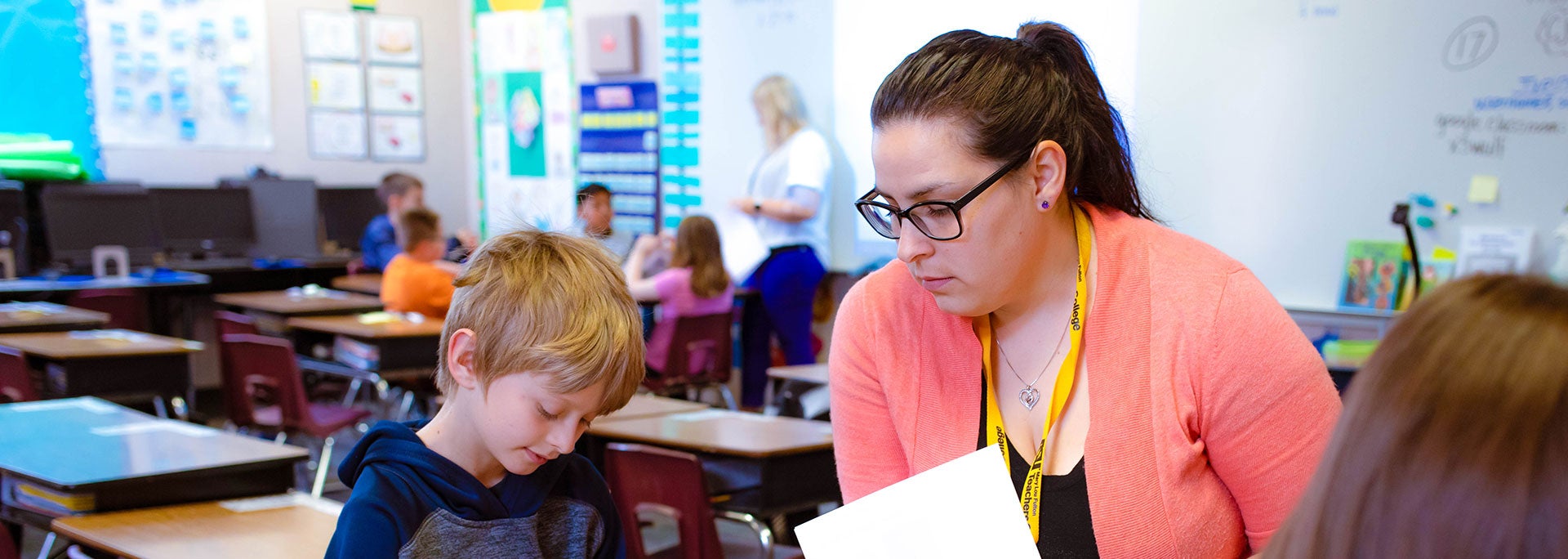 A teacher helping a student